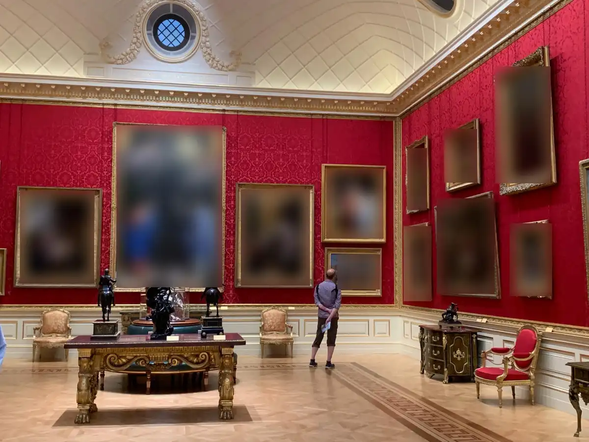 picture of collection of paintings where everything has been blurred to avoid copyright infringement